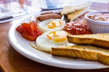 Breakfast with ham and fresh egg on table