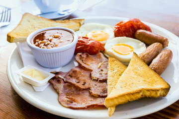 Breakfast with ham and fresh egg on table