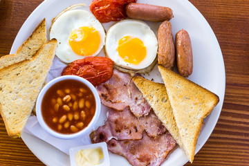Breakfast with ham and fresh egg on table