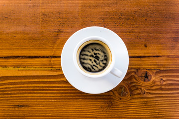 wonderful white cup of hot coffee on table