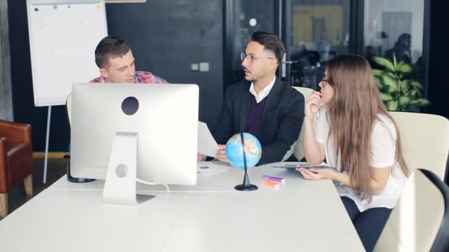 Businessmans team working with new startup project in modern office.