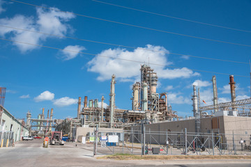 Oil refinery, oil factory, petrochemical plant in Corpus Christi, Texas, USA, cloud blue sky.