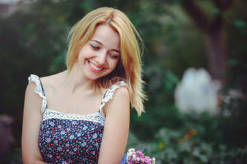 Naklejka premium portrait of a happy woman on a picnic with and smiling, union with nature and a healthy lifestyle