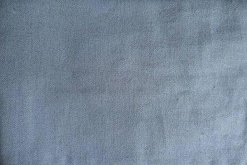 Fototapeta na wymiar Unprinted greyish blue linen fabric from above