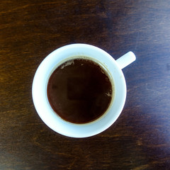 wonderful white cup of hot coffee on table