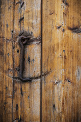 the old wooden door with rusty strength