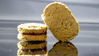 Famous dessert cake matcha dacquoise (French pronunciation) on reflective black background
