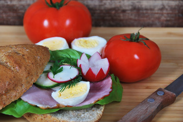 sandwich with radish ham and egg and cucumber salad for breakfast