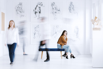 Woman looking at sculpture