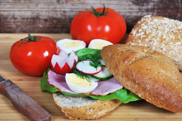 sandwich with radish ham and egg and cucumber salad for breakfast