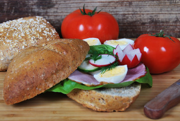 sandwich with radish ham and egg and cucumber salad for breakfast