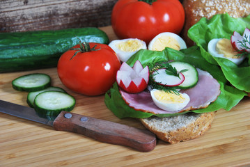 Obraz na płótnie Canvas sandwich with radish ham and egg salad on a dietetic breakfast