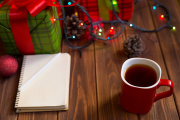 Red cup with hot coffee or cocoa for new year
