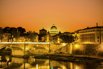 Fototapeta na wymiar The night view of Rome from the Ponte Sant'angelo at sunset, Italy