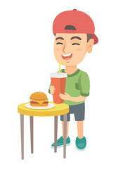 Little caucasian laughing boy drinking soda and eating cheeseburger. Smiling boy standing near the table with fast food. Vector sketch cartoon illustration isolated on white background.