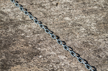 High Angle View of Chain on Asphalt