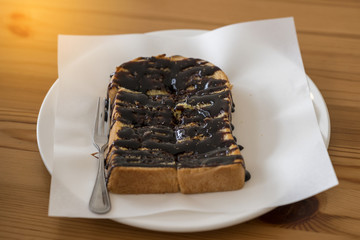 Breaded chocolate cake on table ready to eat.