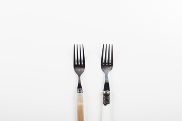 Forks on white background. Copy space.