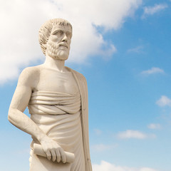 Greece. A monument to Aristotle against the background of the blue sky