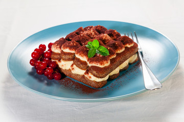 Tiramisu, traditional Italian dessert on a plate