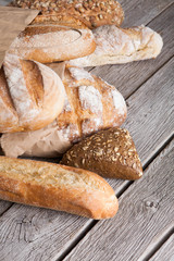 Bread background with copy space on rustic wood