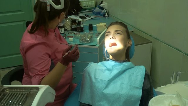 young woman treats her teeth