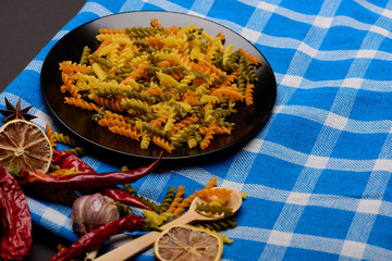 delicious colorful italian pasta with different ingredients for cooking