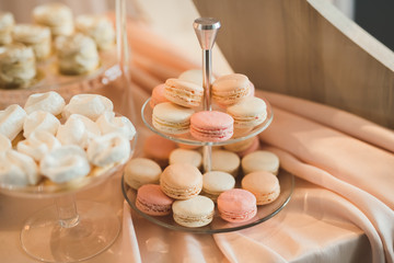 Fototapeta na wymiar French sweet colorful macarons background, close up