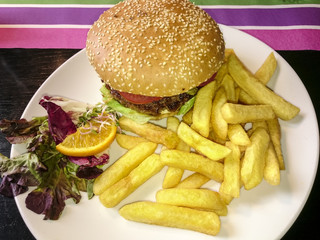 Burger, French fries and lettuce