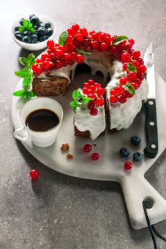 breakfast banana bread bundt cake with fresh berries and  cup of hot espresso coffee. happy break