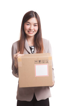 Young Asian working  woman with 3 heavy  shipping boxes.