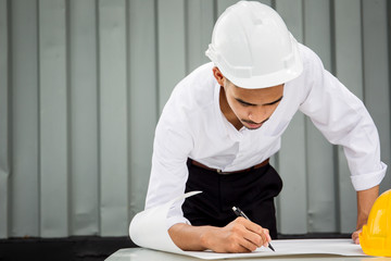 Portrait of Asian engineer working outdoor close up.