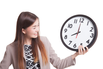 Young Asian woman with a clock.