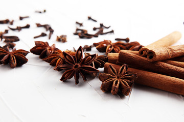 cinnamon, staranise and cloves. winter spices on white background