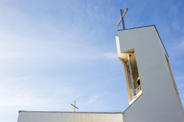 Photograph of church roof top in the beautiful blue sky.