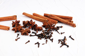 cinnamon, staranise and cloves. winter spices on white background