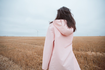 Girl in raincoat.Autumn portrait hipster girl in a coat