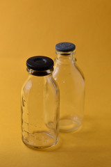 Medical bottles on yellow