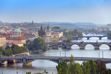 Fototapeta na wymiar Prague, Czech Republic. Panorama of the old city from the embankment and bridges through the Vltava River