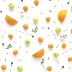 Fruity pattern. Fruits, plants and flowers on a white background. Food background. Top view.