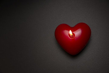 Heart Shaped Candle On A Dark Surface