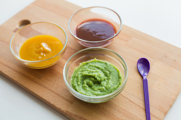 vegetable puree or baby food in glass bowls