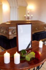 photo frame and coffin at funeral in church