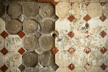 Old tiles on an old wall