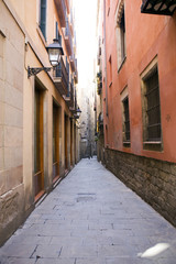 Fototapeta na wymiar narrow street in old district of Barcelona