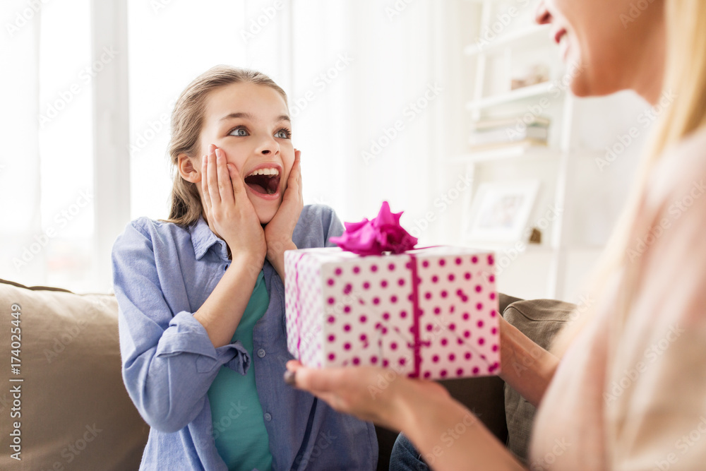 Canvas Prints mother giving birthday present to girl at home