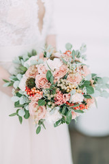 the bride's bouquet of peonies and roses, asymmetrical and modern