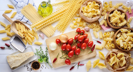 Pasta and ingredients: tomatoes, parmigiano, extra virgin, pens, shells, rigatoni, mafalda, linguine, fusilli and squid