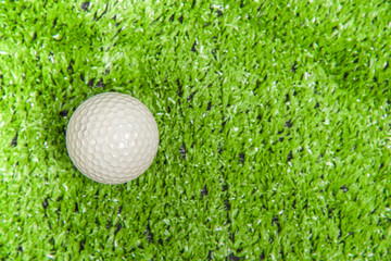 Golf ball on the green lawn or green grass