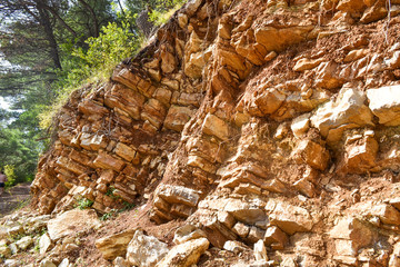 Texture of the rock. Large rocks exfoliate from the rock.